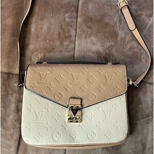 Faux Louis Vuitton purse.